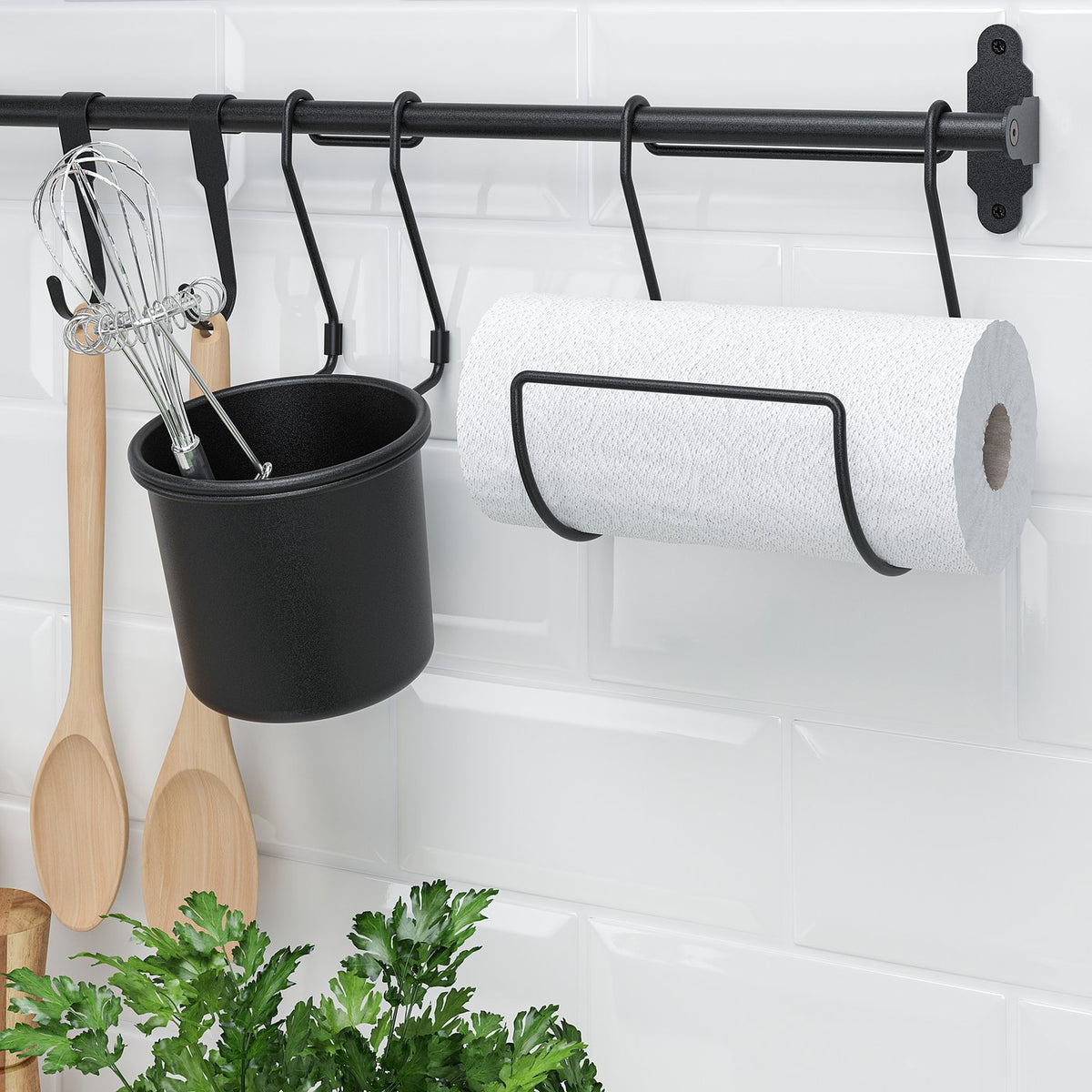 Kitchen rack with utensils and paper towel holder mounted on wall.