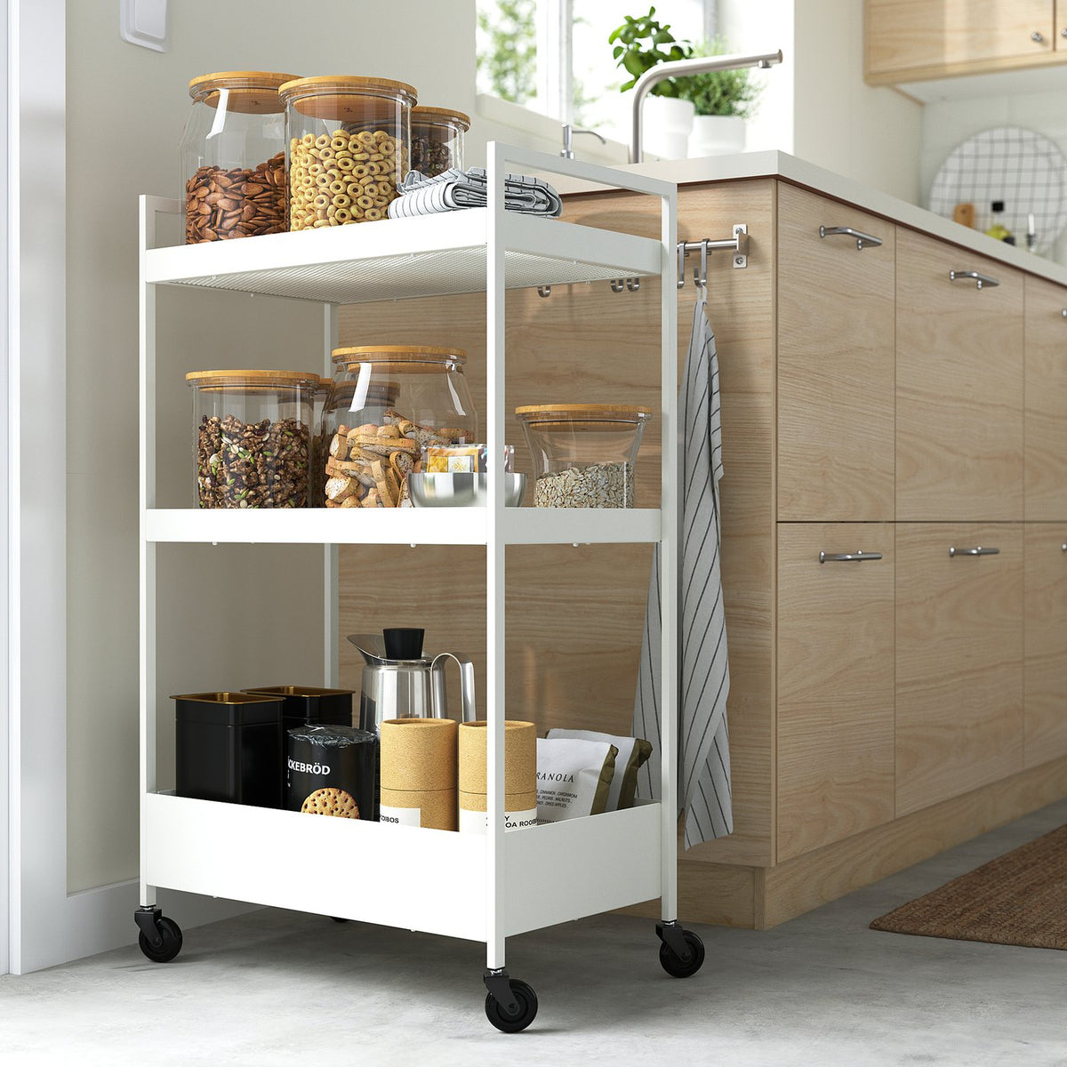 NISSAFORS: 3-tier kitchen cart with food items.