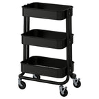 Black RÅSKOG trolley with three shelves and wheels. Modern storage design for small spaces.